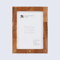 Brown wood and brass star picture frame